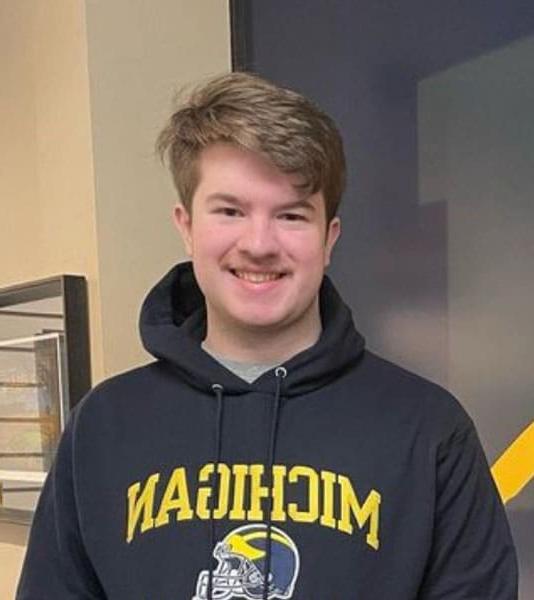 Jayman from Indiana Connections Career Academy wearing a Michigan sweatshirt. 